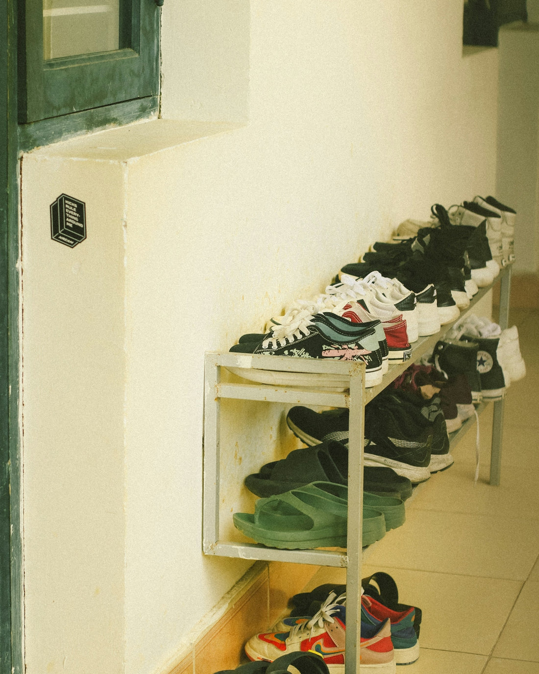 a bunch of shoes that are on a shelf