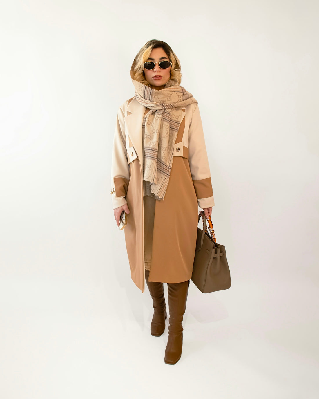 Stylish woman in fashionable outfit and accessories.