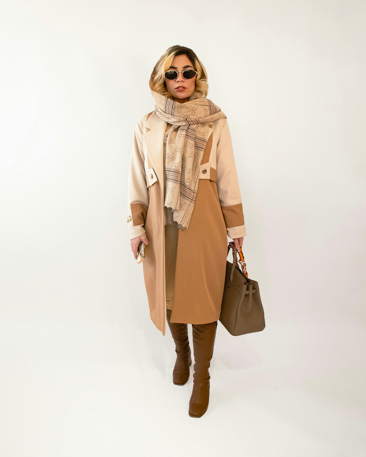 Stylish woman in fashionable outfit and accessories.