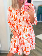 Tryckt hackad långärmad klänning