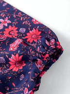 Bluză florală cu jumătate de mânecă despicată