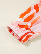 Tryckt hackad långärmad klänning