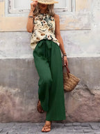 Potištěné nádrž a široké kalhoty nohou